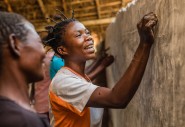 Patience teaches women the alphabet in Manono, Tanganyika. Photo: Pamela Tulizo/ Panos Pictures 